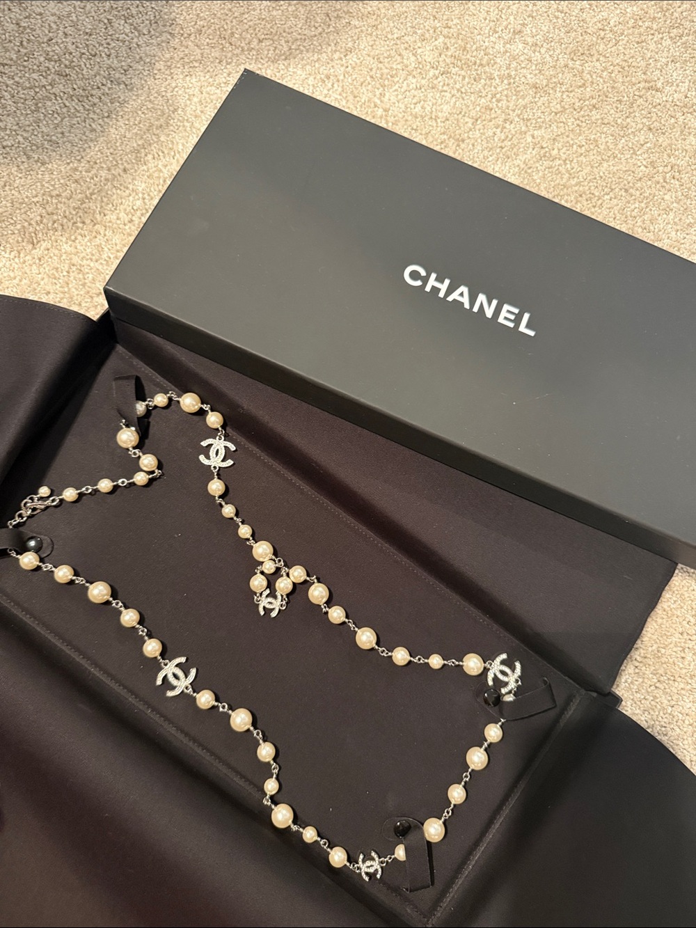CHANEL Long Pearl Necklace with Silver CC Logos